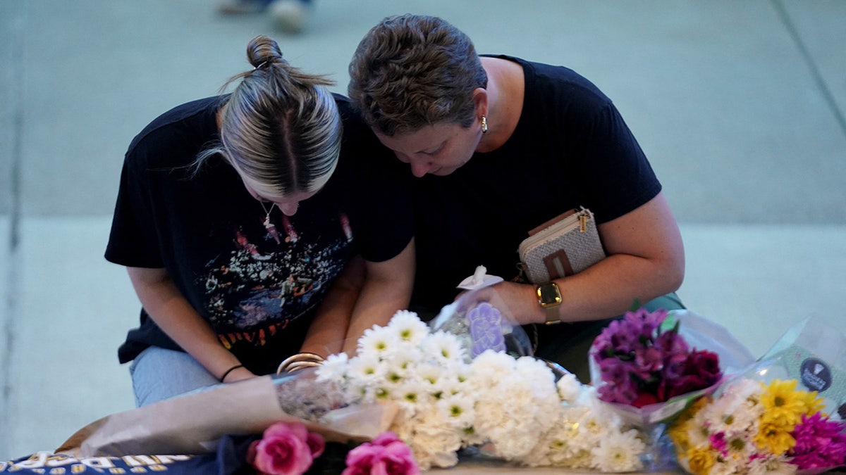 People attend a vigil at Jug Tavern Park following a shooting at Apalachee High School