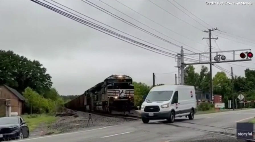 Van narrowly avoids being hit by train in Virginia